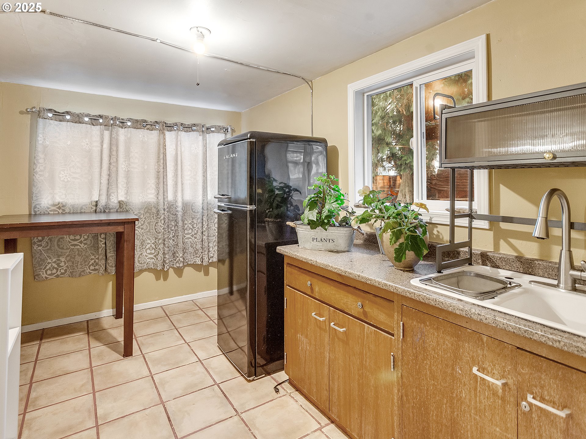 299 Southwest 3rd Avenue Canby, OR 97013 - Photo 20 of 32 a kitchen with stainless steel appliances a sink and cabinets