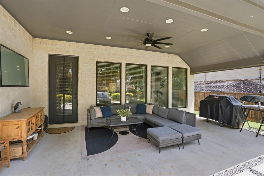904 Fallbrook Avenue Denton, TX 76210 - Photo 28 of 30 a living room with furniture and a fireplace