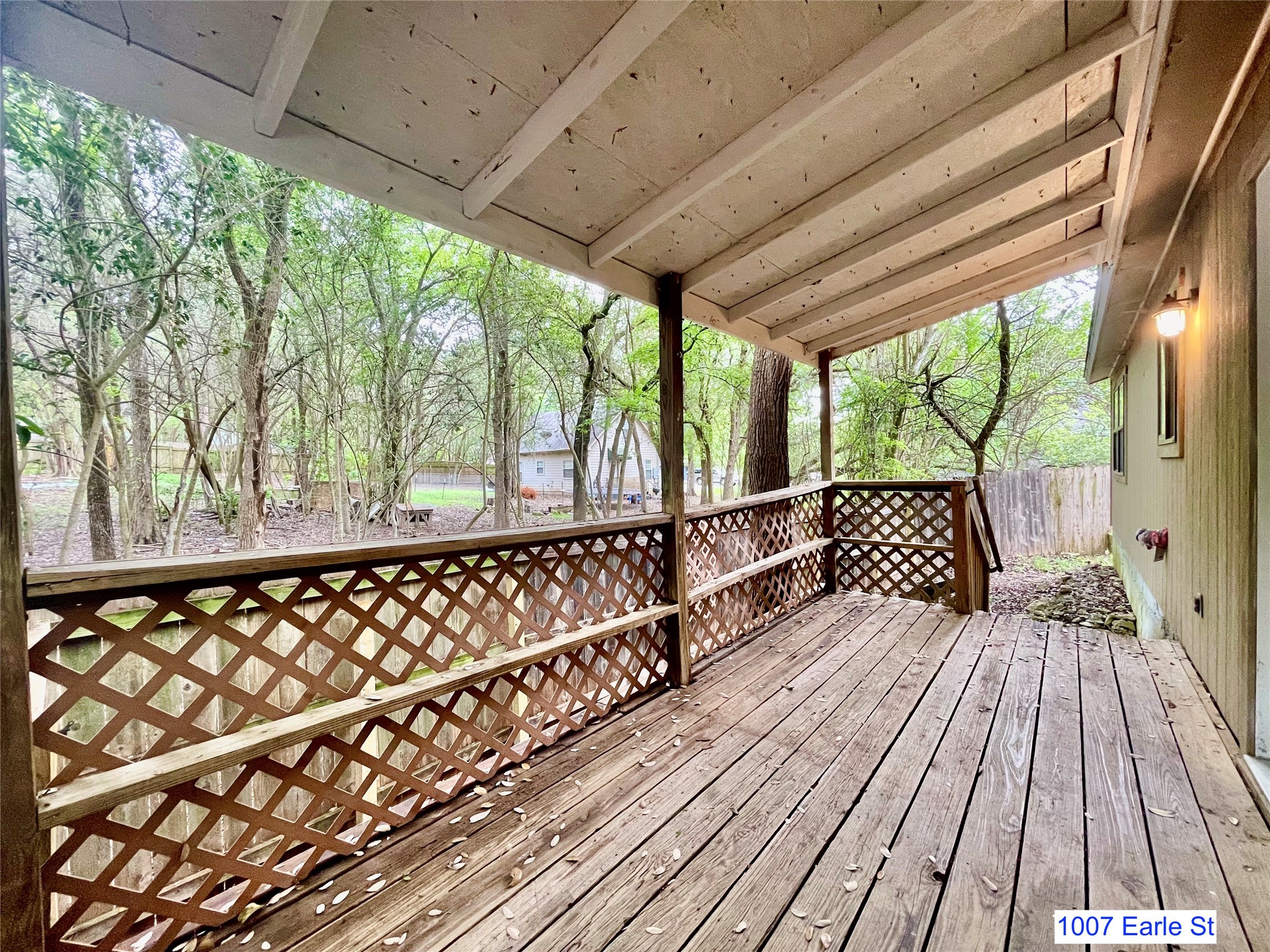 1007-1015 Earle Street San Marcos, TX 78666 - Photo 12 of 25 a balcony with wooden floor