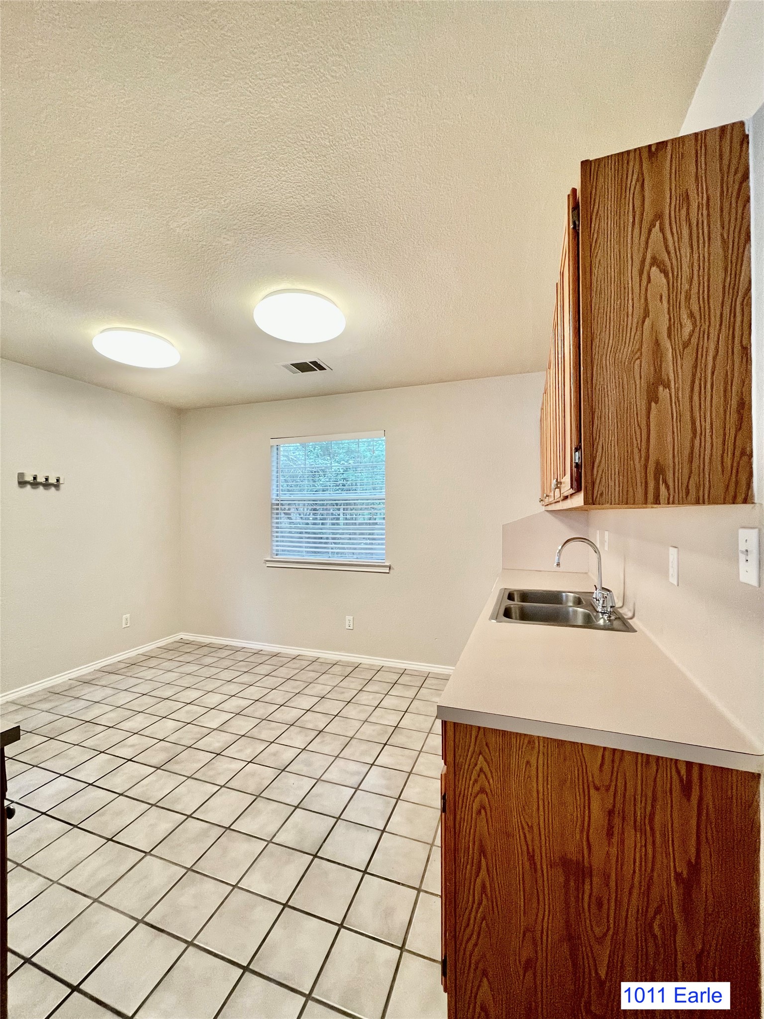 1007-1015 Earle Street San Marcos, TX 78666 - Photo 17 of 25 a bedroom with a sink and a mirror