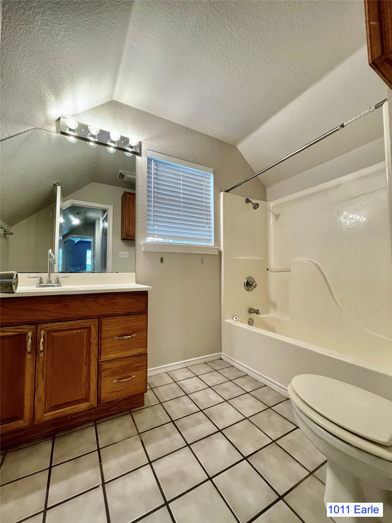 1007-1015 Earle Street San Marcos, TX 78666 - Photo 21 of 25 a bathroom with a sink a toilet and shower