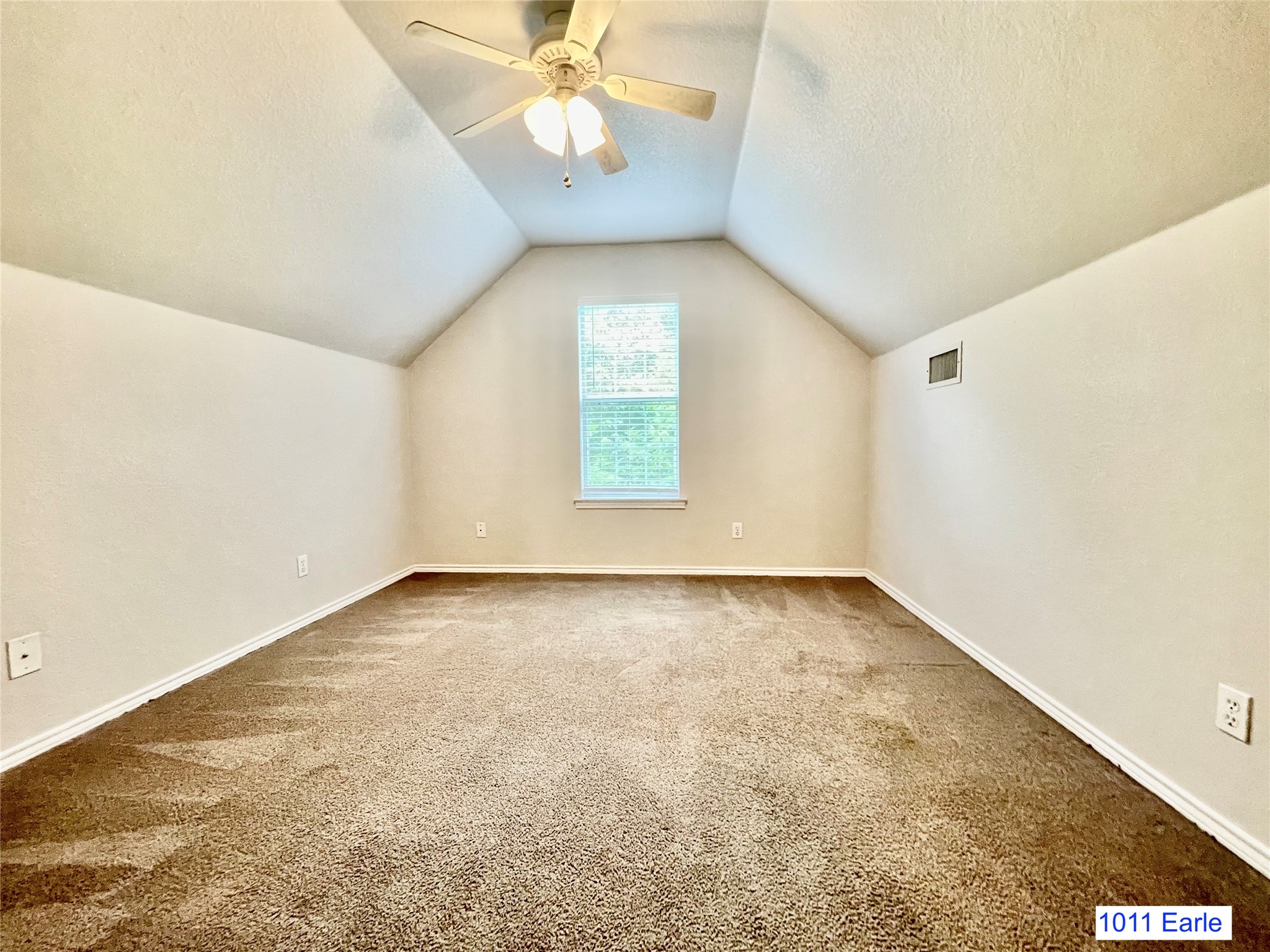 1007-1015 Earle Street San Marcos, TX 78666 - Photo 22 of 25 an empty room with a chandelier fan and windows