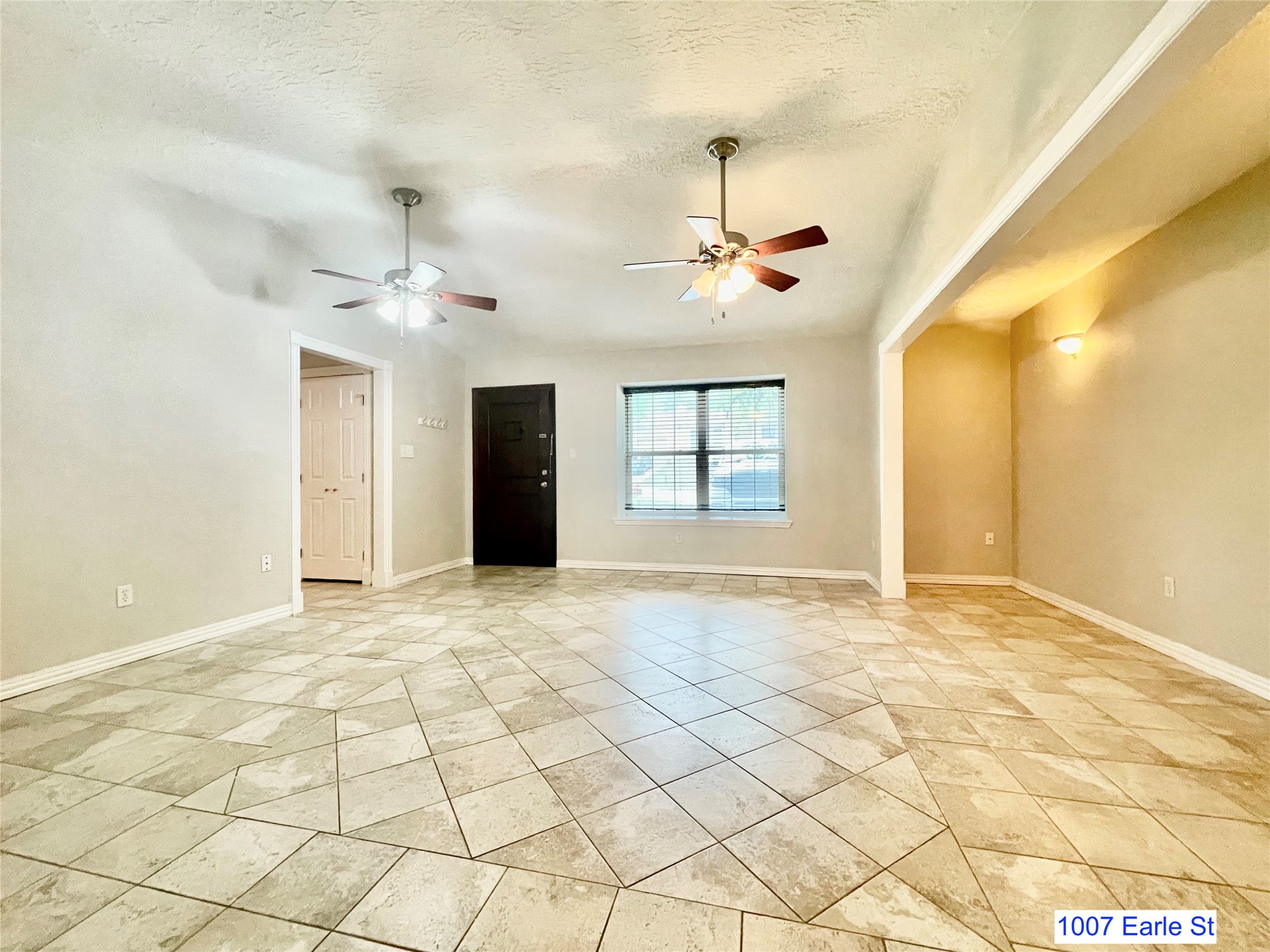 1007-1015 Earle Street San Marcos, TX 78666 - Photo 4 of 25 a view of an empty room with a window
