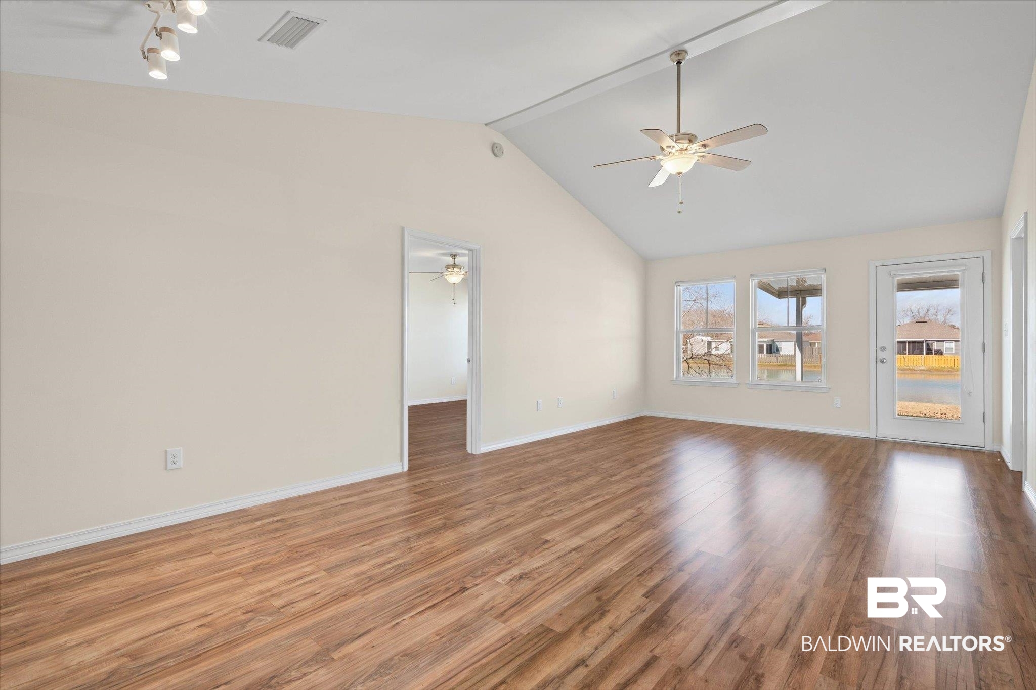 919 Sailor Circle Foley, AL 36535 - Photo 2 of 24 Unfurnished room with wood finished floors and ceiling fan