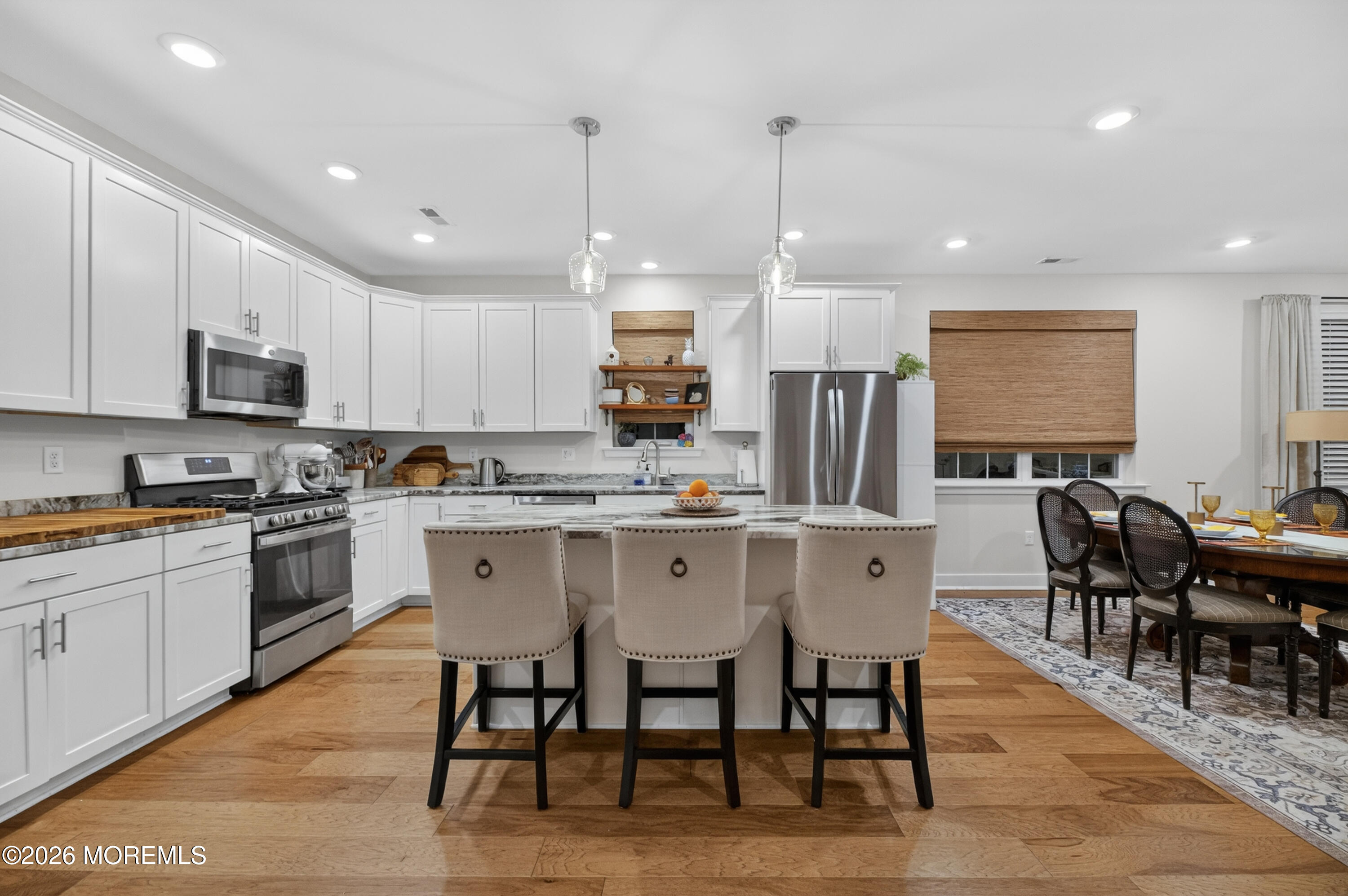 35 Saratoga Road New Egypt, NJ 08533 - Photo 12 of 43 a kitchen with stainless steel appliances granite countertop a table chairs sink refrigerator and microwave