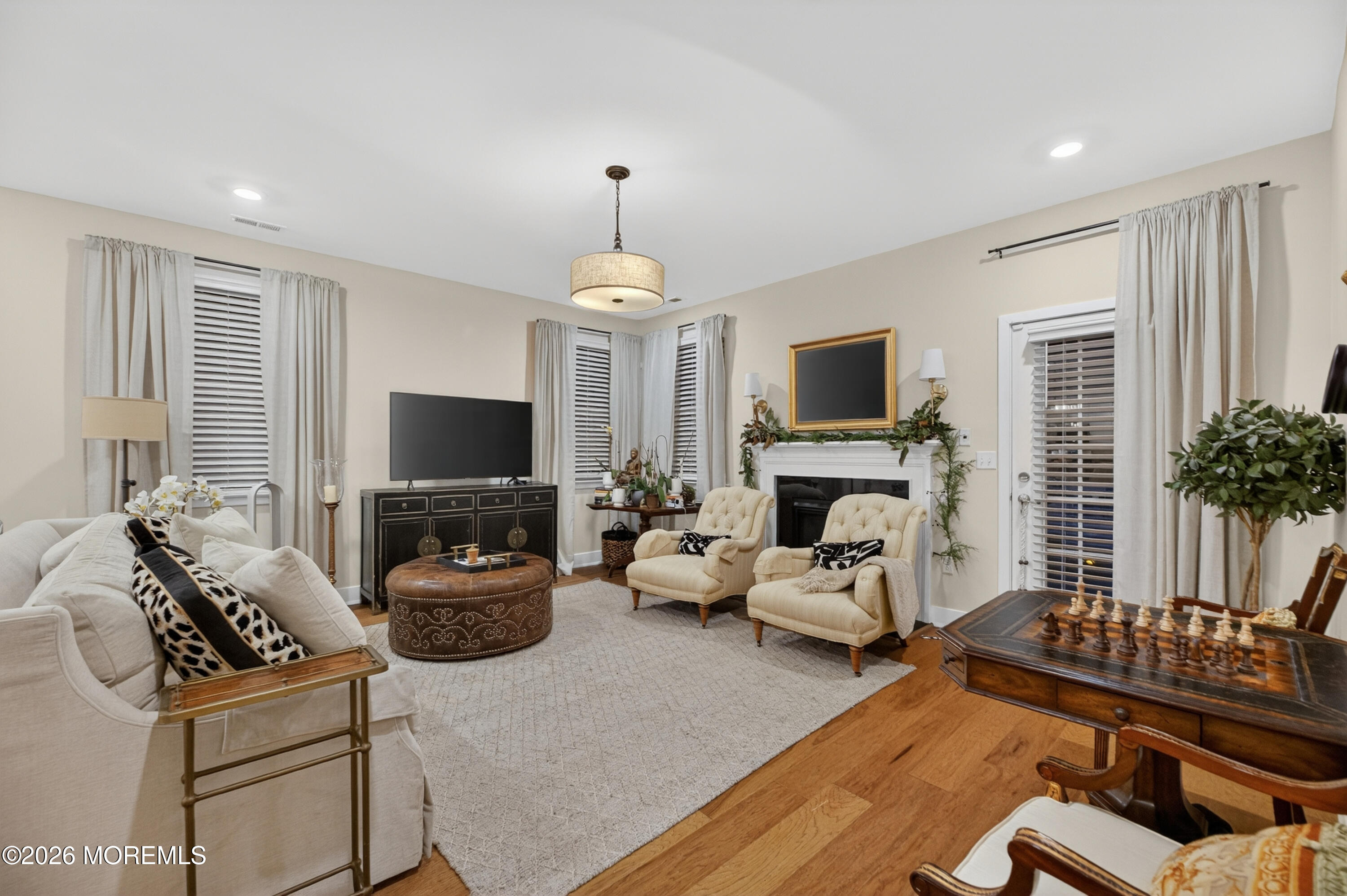 35 Saratoga Road New Egypt, NJ 08533 - Photo 6 of 43 a living room with furniture a fireplace and a flat screen tv