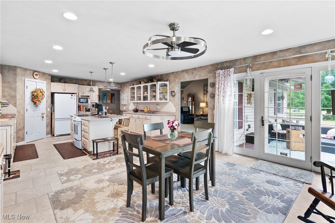 6810 South Ridge Road West Geneva, OH 44041 - Photo 6 of 41 Dining area with a ceiling fan, french doors, and recessed lighting