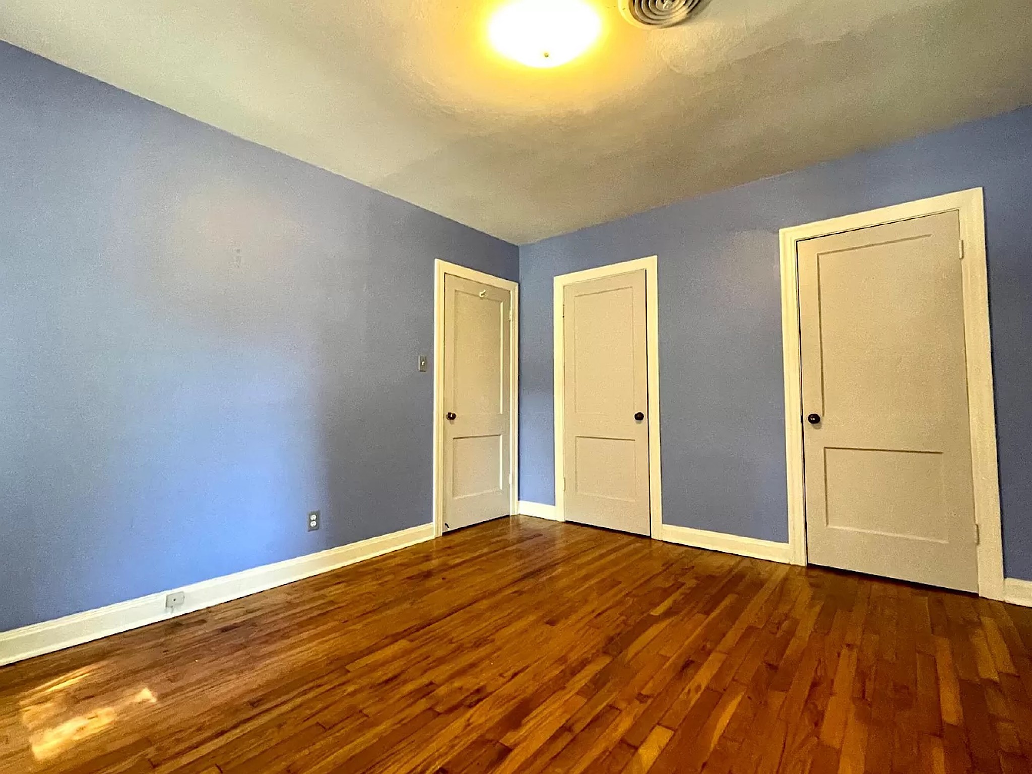 4104 Ridgelea Drive Austin, TX 78731 - Photo 11 of 16 Second bedroom entry door and two closets.