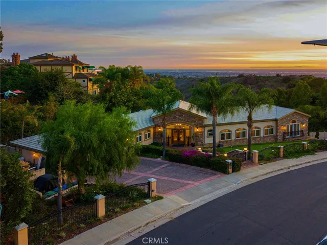 a view of house with a garden and a yard