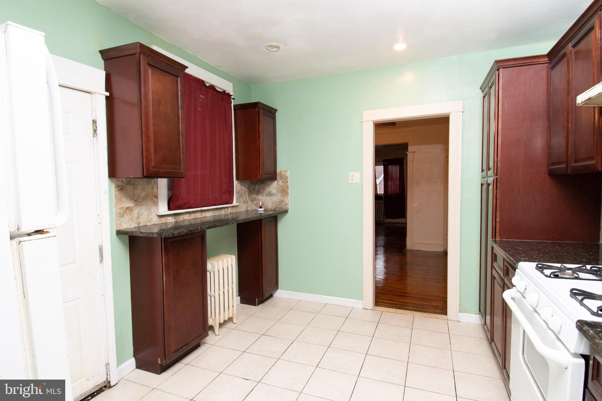291 Sanford Road Upper Darby, PA 19082 - Photo 3 of 18 a kitchen with stainless steel appliances a stove and a refrigerator