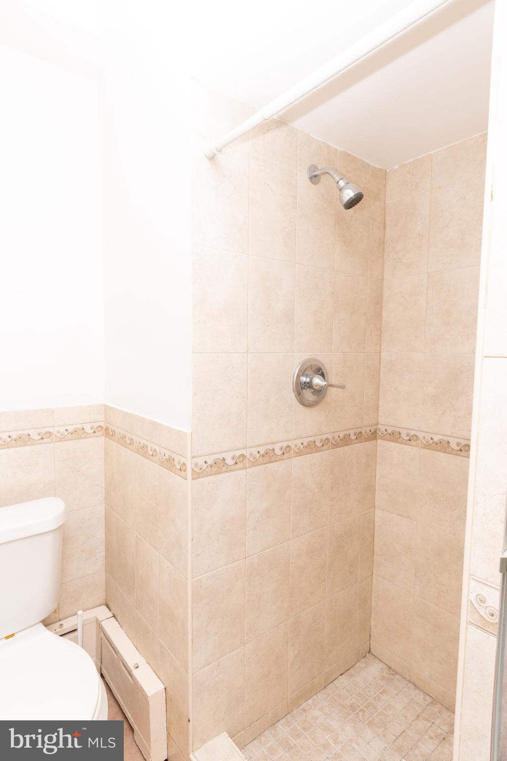 291 Sanford Road Upper Darby, PA 19082 - Photo 9 of 18 a bathroom with a toilet and a shower