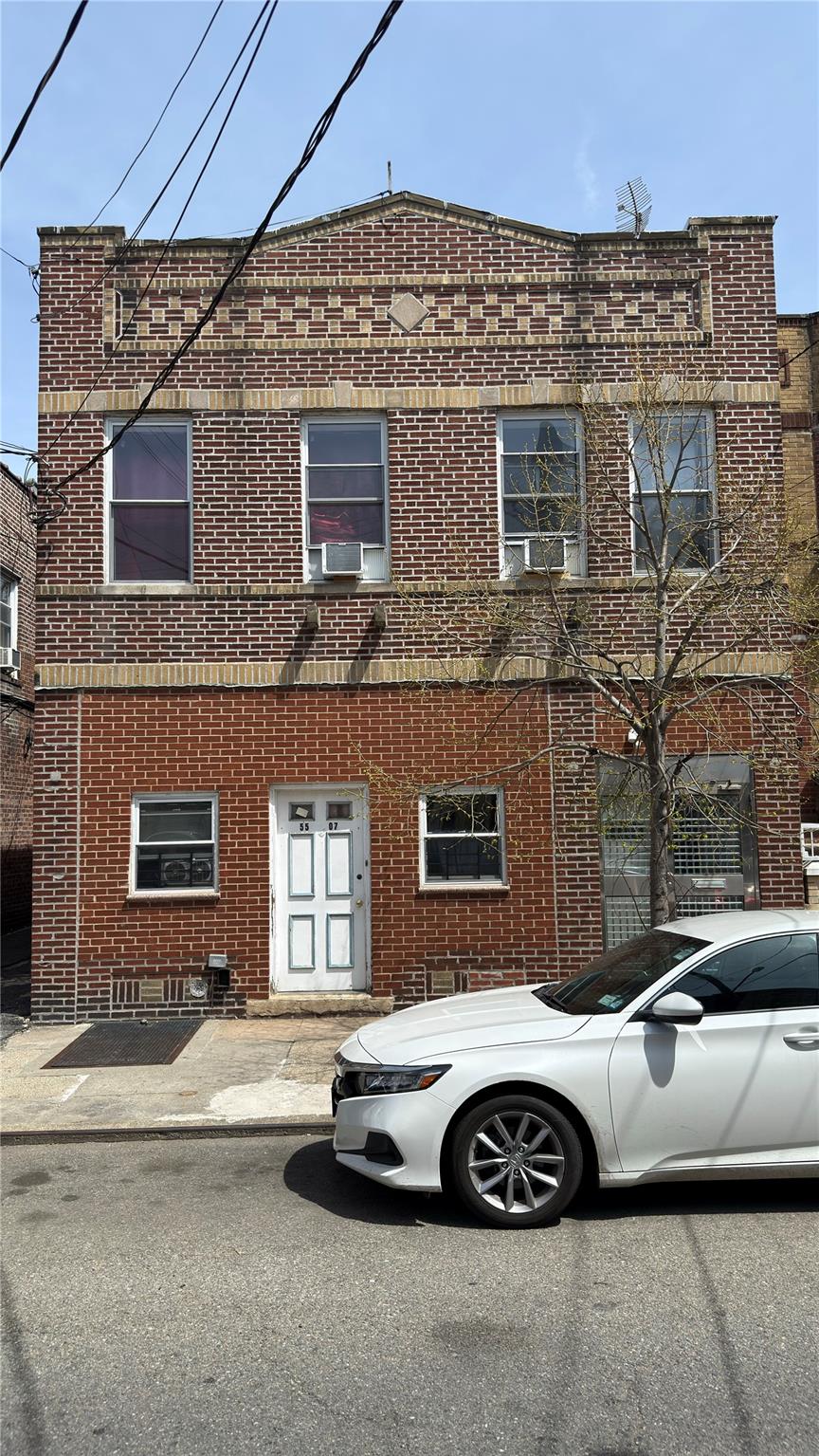 55-07 103rd Street Queens, NY 11368 - Photo 6 of 10 View of property featuring brick siding and cooling unit