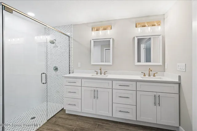 a bathroom with a bathtub and shower