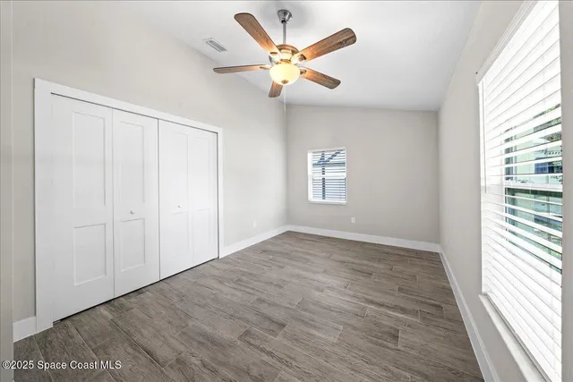 a bathroom with a sink toilet vanity and shower