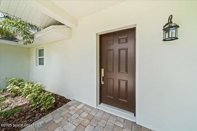 a view of a lake with a house in the background