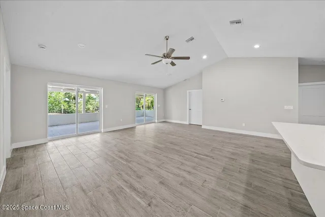 a kitchen with stainless steel appliances a refrigerator sink and microwave