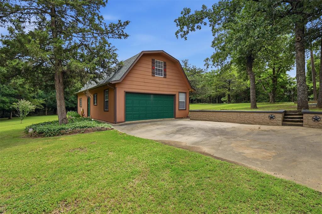 570 Ayres Road Bells, TX 75414 - Photo 6 of 40 a front view of a house with a yard