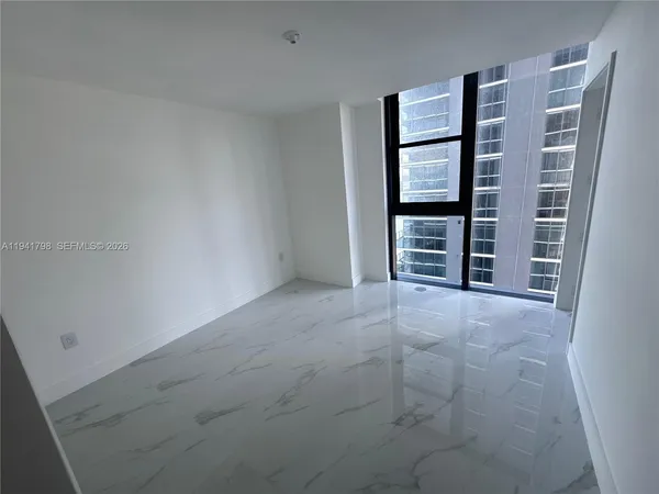 a bathroom with a bathtub and double vanity