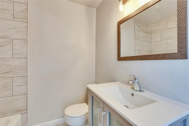 a bathroom with a sink and a toilet