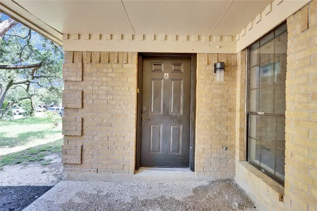 a view of a bathroom with a shower and a sink