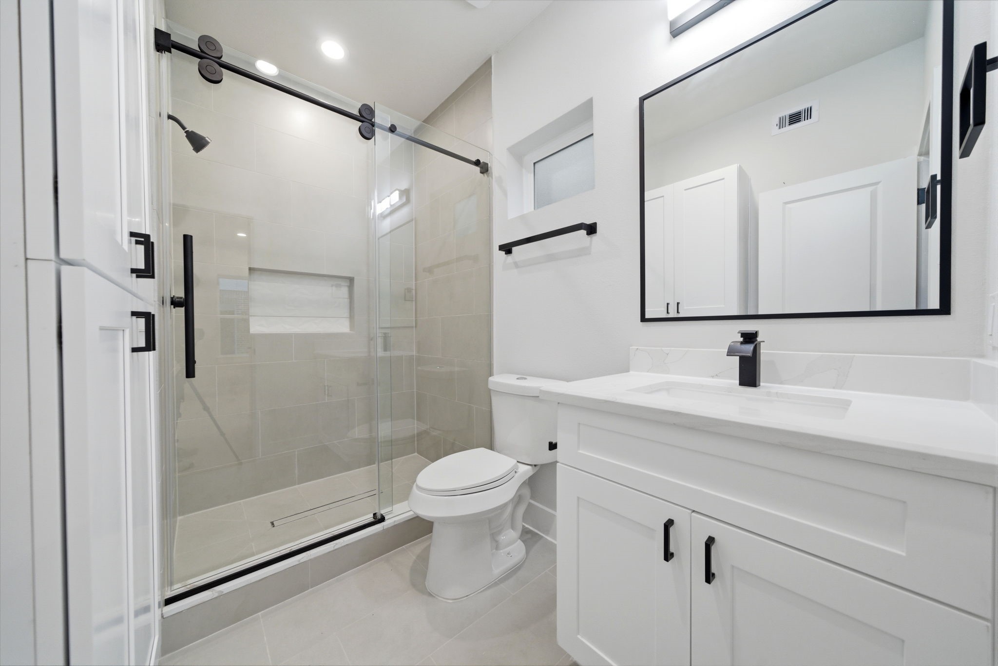 330 Janisch Road, Unit A Houston, TX 77018 - Photo 7 of 40 a bathroom with a sink a toilet and shower