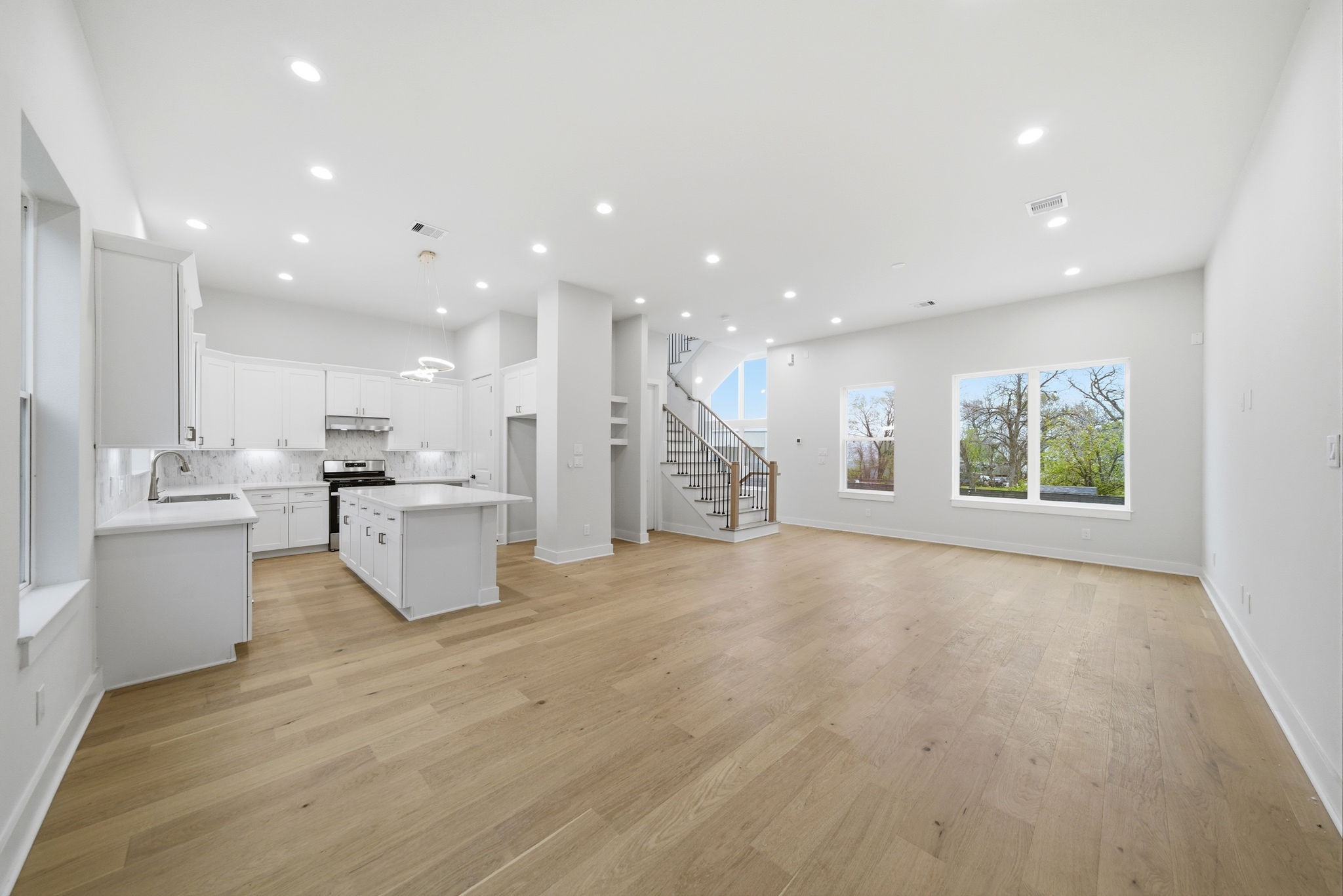 330 Janisch Road, Unit A Houston, TX 77018 - Photo 10 of 40 a large kitchen with a large counter top and stainless steel appliances