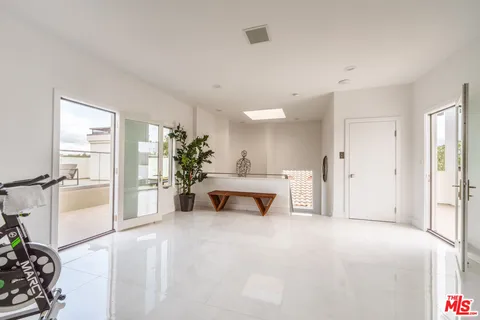 a view of a kitchen with washer and dryer