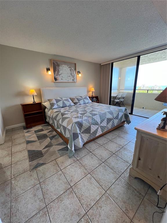 5915 Sea Ranch Drive, Unit 512 Hudson, FL 34667 - Photo 22 of 55 a bedroom with a bed and window