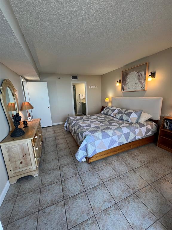 5915 Sea Ranch Drive, Unit 512 Hudson, FL 34667 - Photo 23 of 55 a bedroom with a bed and window