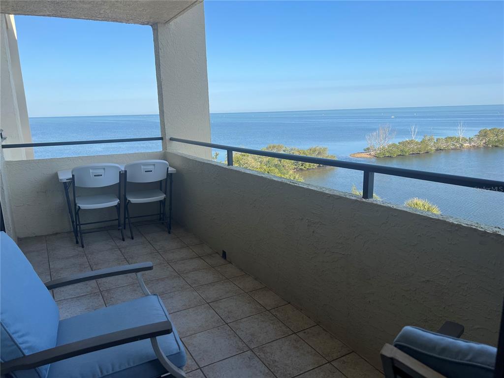 5915 Sea Ranch Drive, Unit 512 Hudson, FL 34667 - Photo 28 of 55 a view of a chairs and table on the terrace