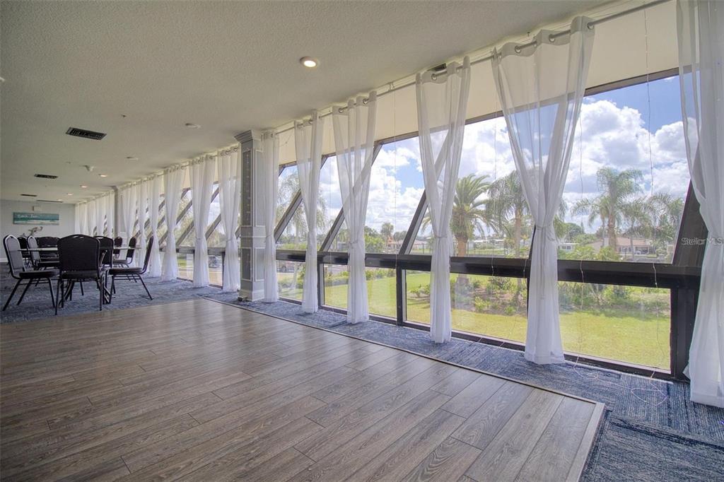 5915 Sea Ranch Drive, Unit 512 Hudson, FL 34667 - Photo 44 of 55 a view of an empty room with wooden floor and iron floor