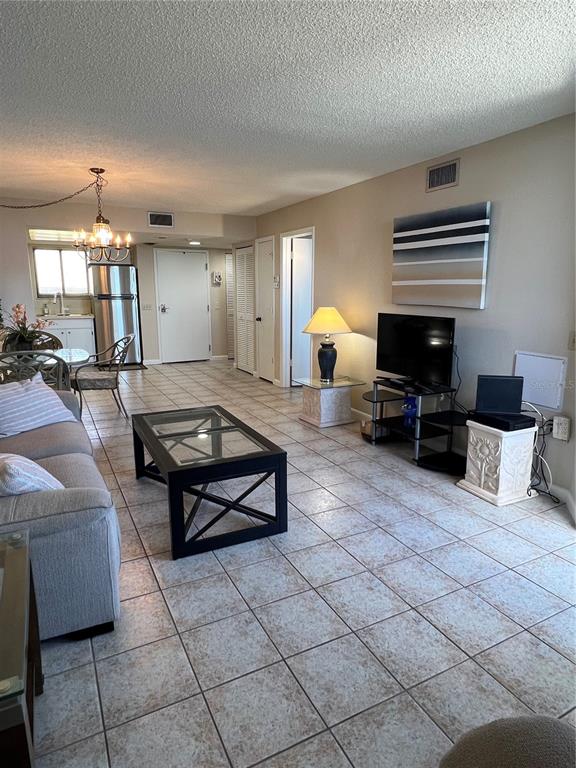 5915 Sea Ranch Drive, Unit 512 Hudson, FL 34667 - Photo 6 of 55 a living room with furniture and a fireplace