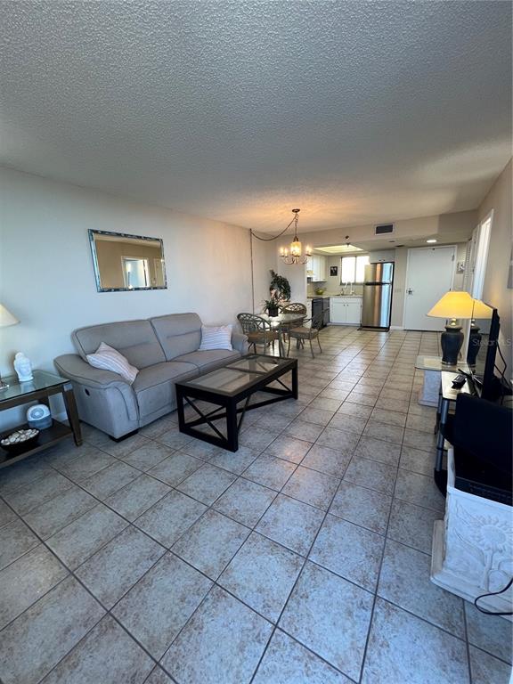 5915 Sea Ranch Drive, Unit 512 Hudson, FL 34667 - Photo 10 of 55 a living room with furniture and a lamp