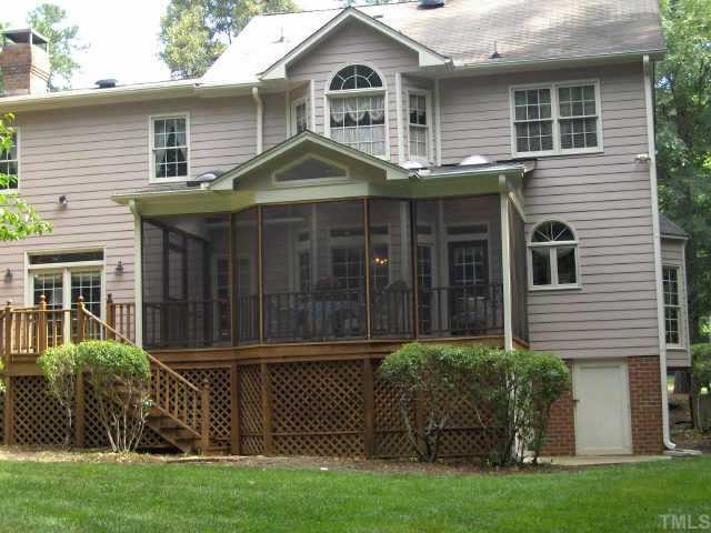3011 Eubanks Road Durham, NC 27707 - Photo 10 of 10 Screened Porch w/ skylights ceiling fan and attached deck overlooking landscaped rear yard