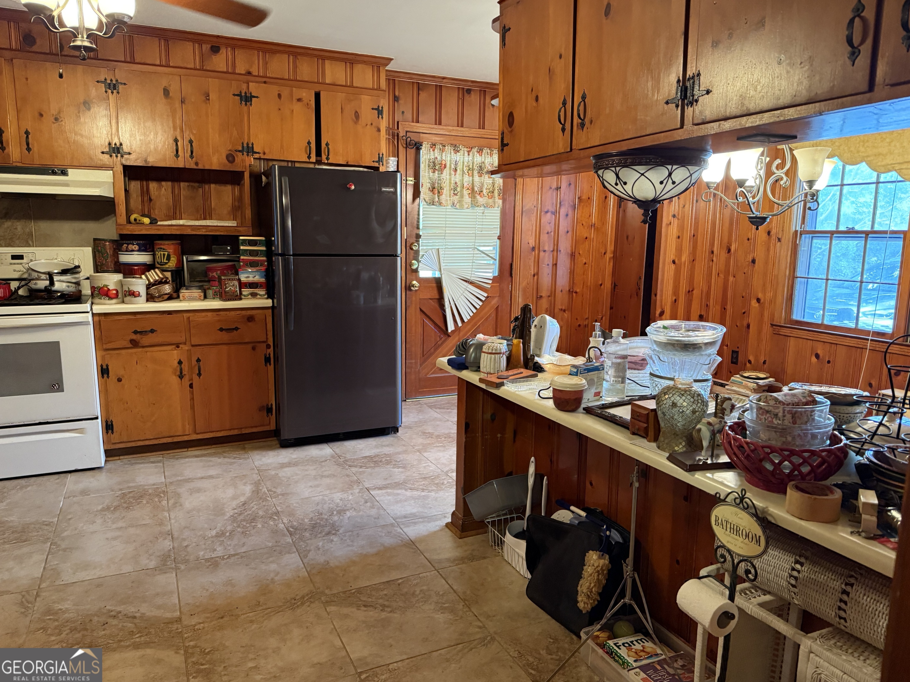 641 South Masonic Street Millen, GA 30442 - Photo 12 of 20 a kitchen with stainless steel appliances granite countertop a refrigerator and a stove top oven