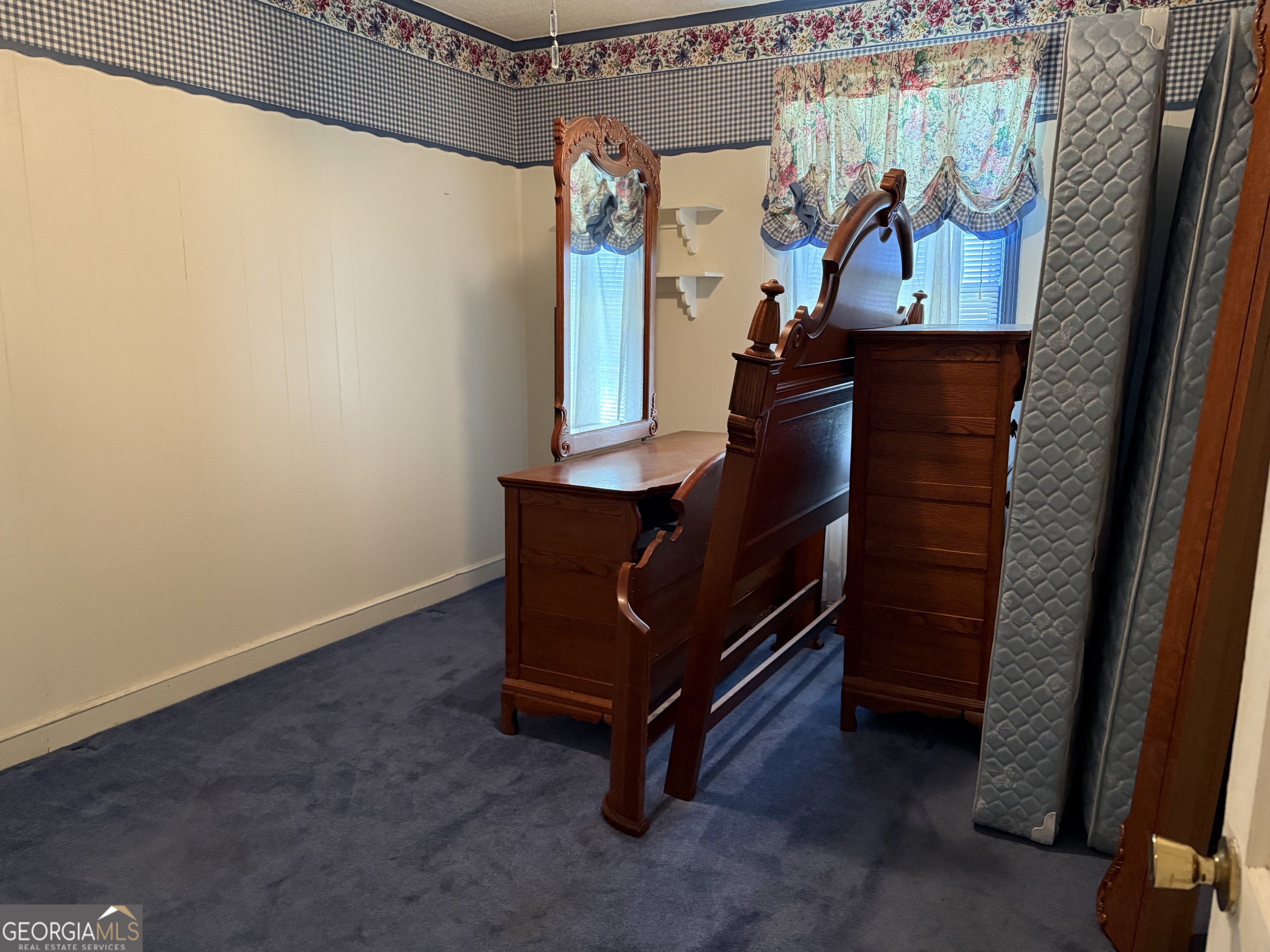 641 South Masonic Street Millen, GA 30442 - Photo 16 of 20 a view of a room with wooden floor and furniture