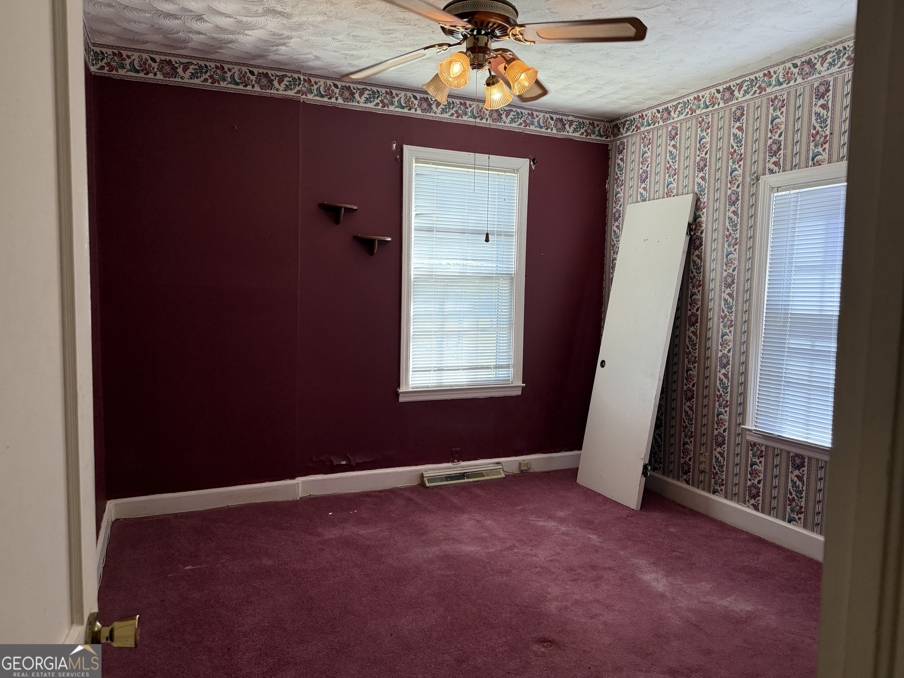 641 South Masonic Street Millen, GA 30442 - Photo 17 of 20 an empty room with windows