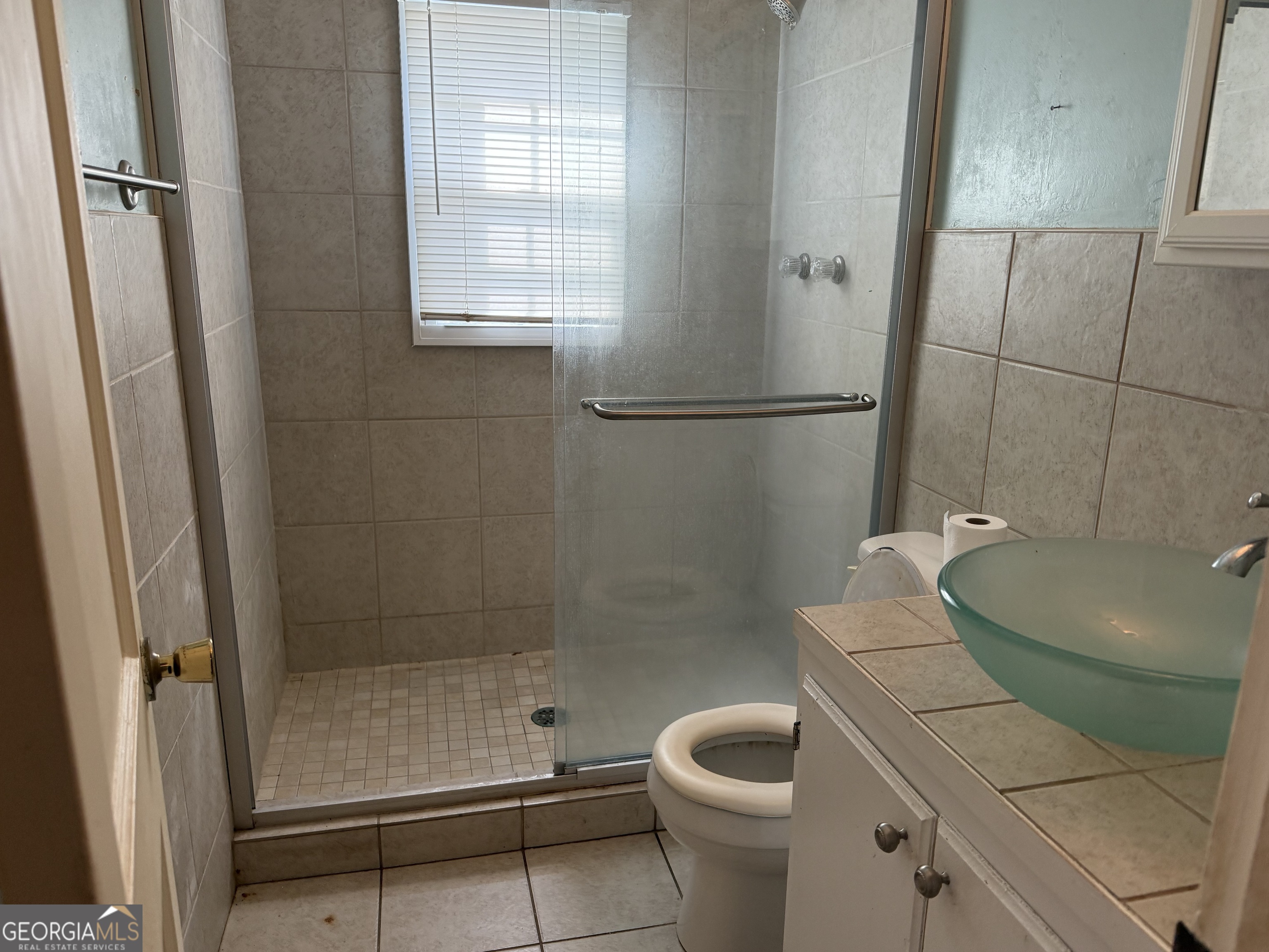 641 South Masonic Street Millen, GA 30442 - Photo 18 of 20 a bathroom with a sink and toilet