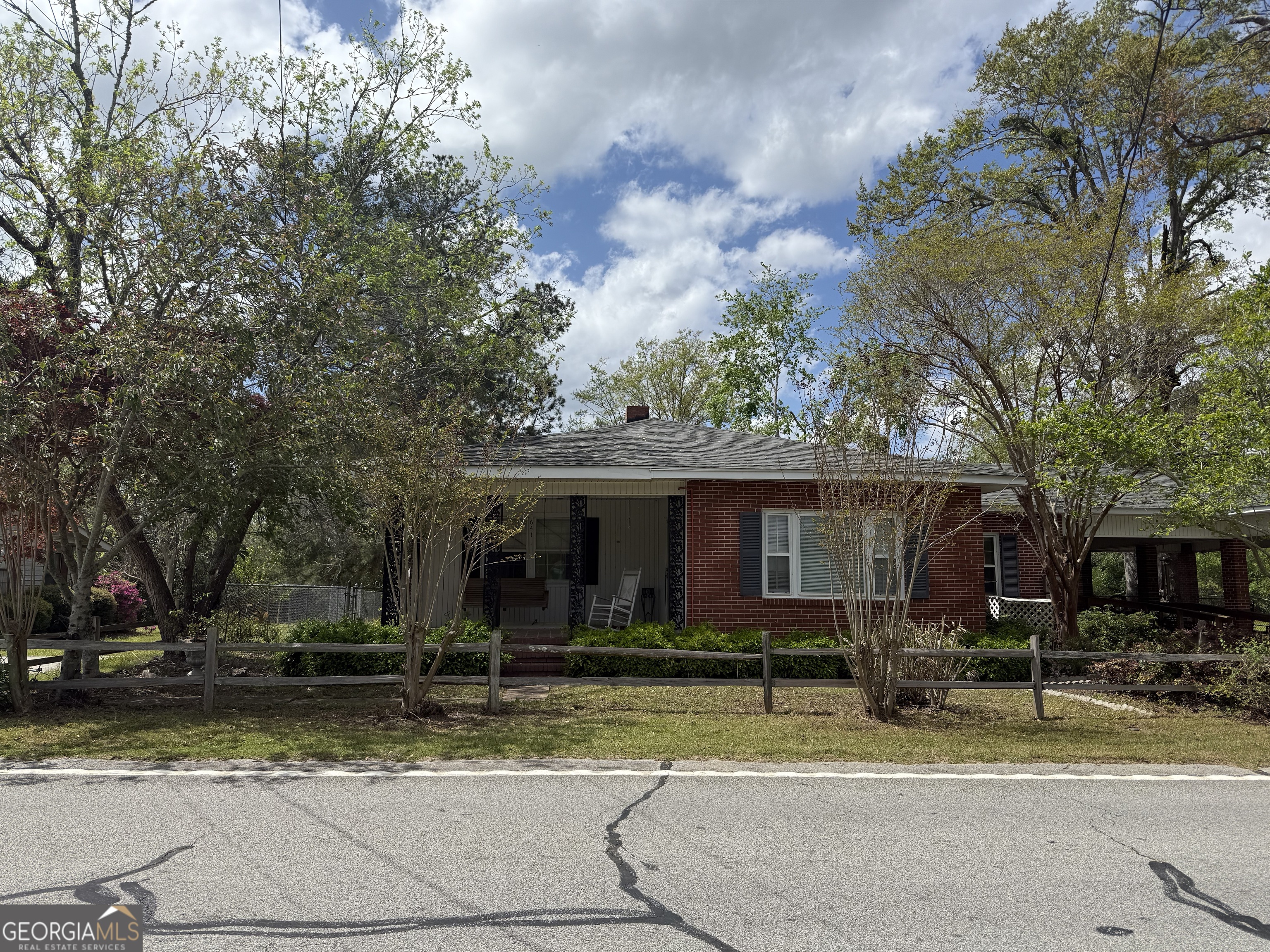 641 South Masonic Street Millen, GA 30442 - Photo 2 of 20 a view of house with outdoor space and tall trees