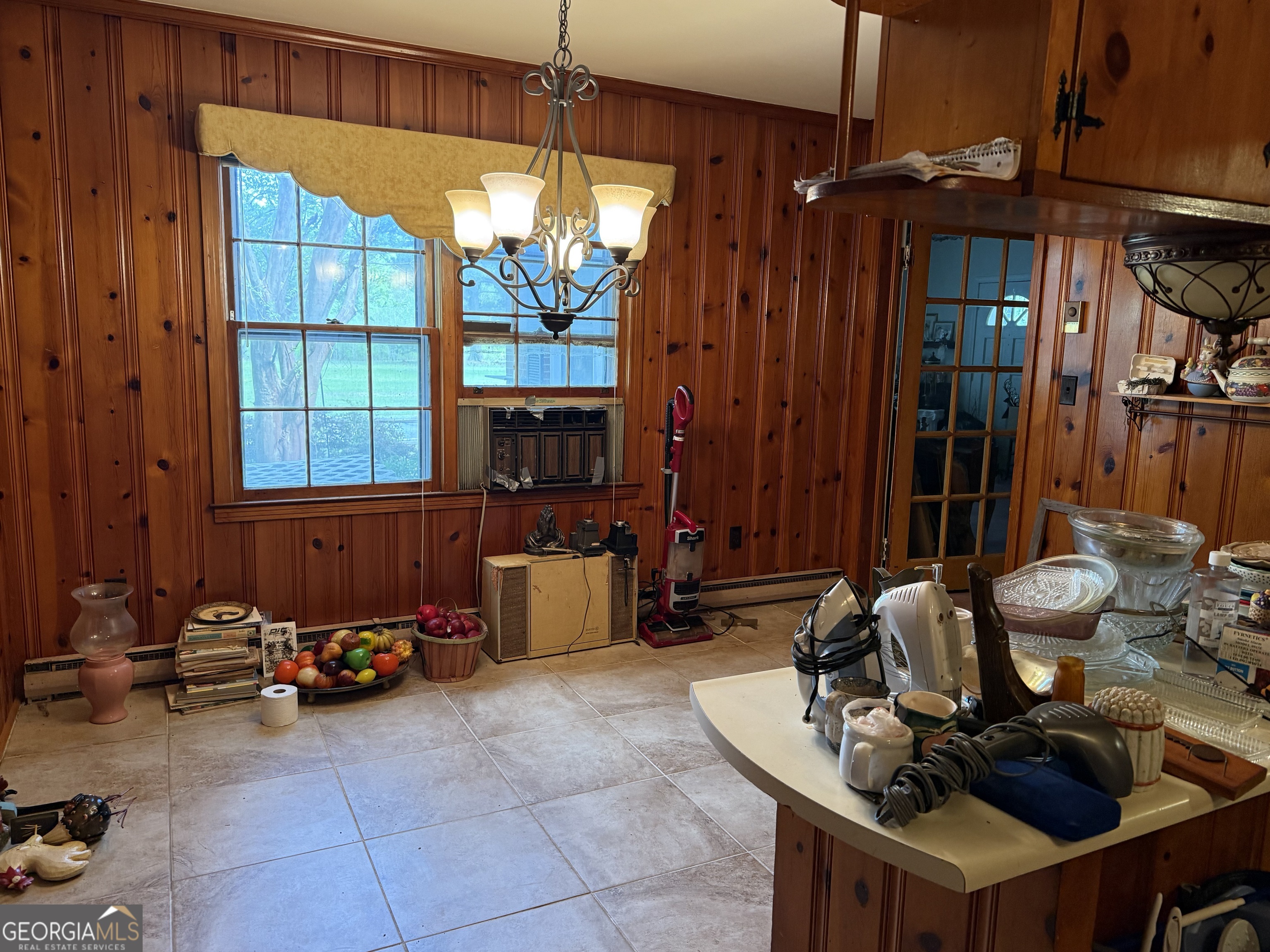 641 South Masonic Street Millen, GA 30442 - Photo 5 of 20 a room with furniture and window