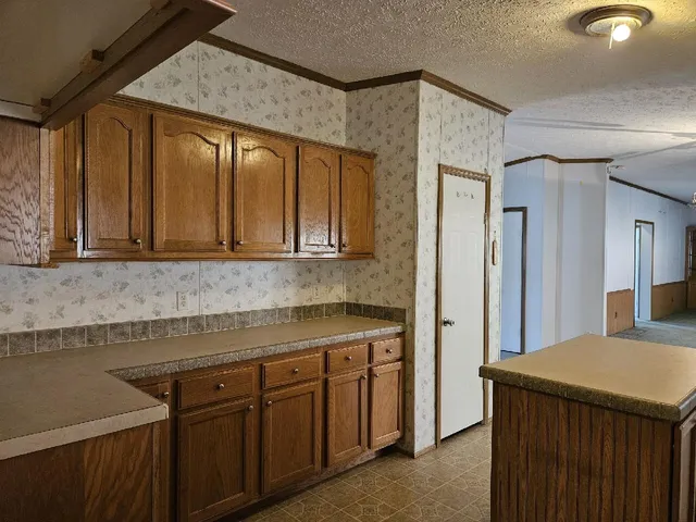 a kitchen with a sink and cabinets