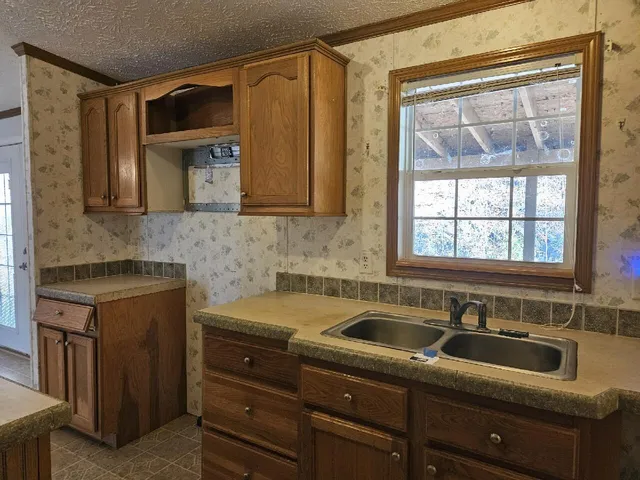 a kitchen with a sink and cabinets