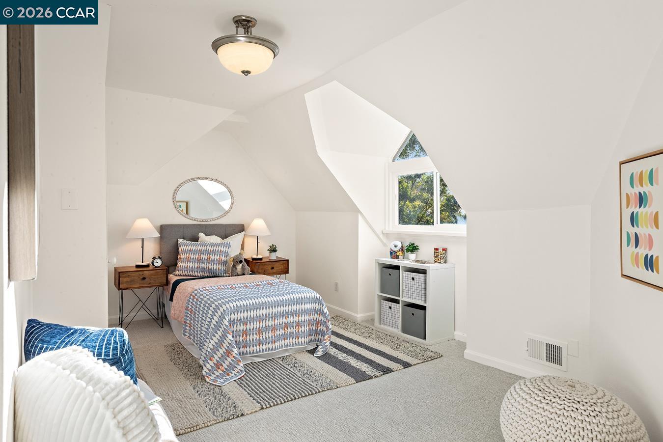 85 Ardmore Road Kensington, CA 94707 - Photo 34 of 45 a bedroom with a bed and a chandelier