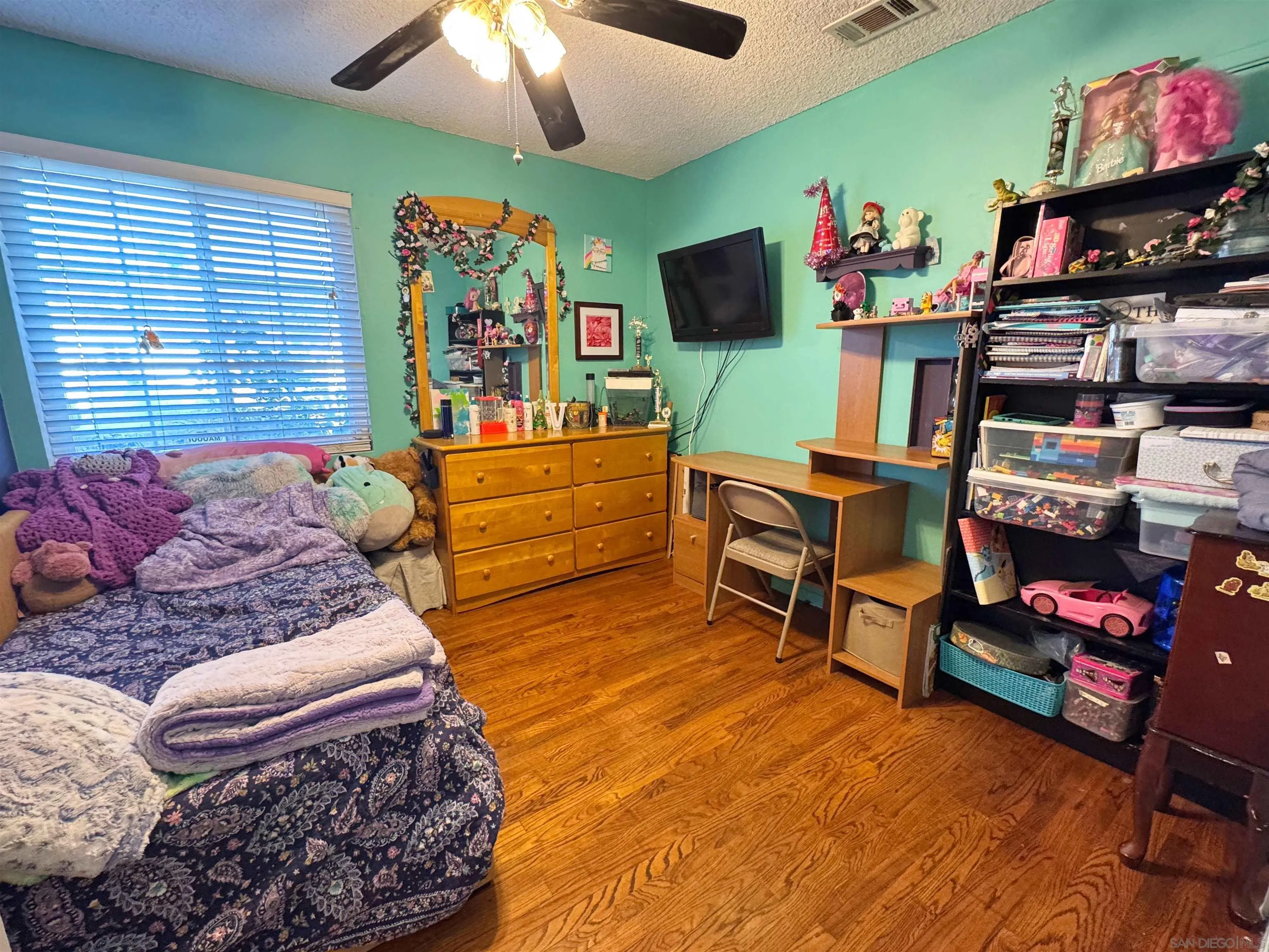 1117 Kings Road Escondido, CA 92027 - Photo 20 of 37 a living room with furniture and a flat screen tv