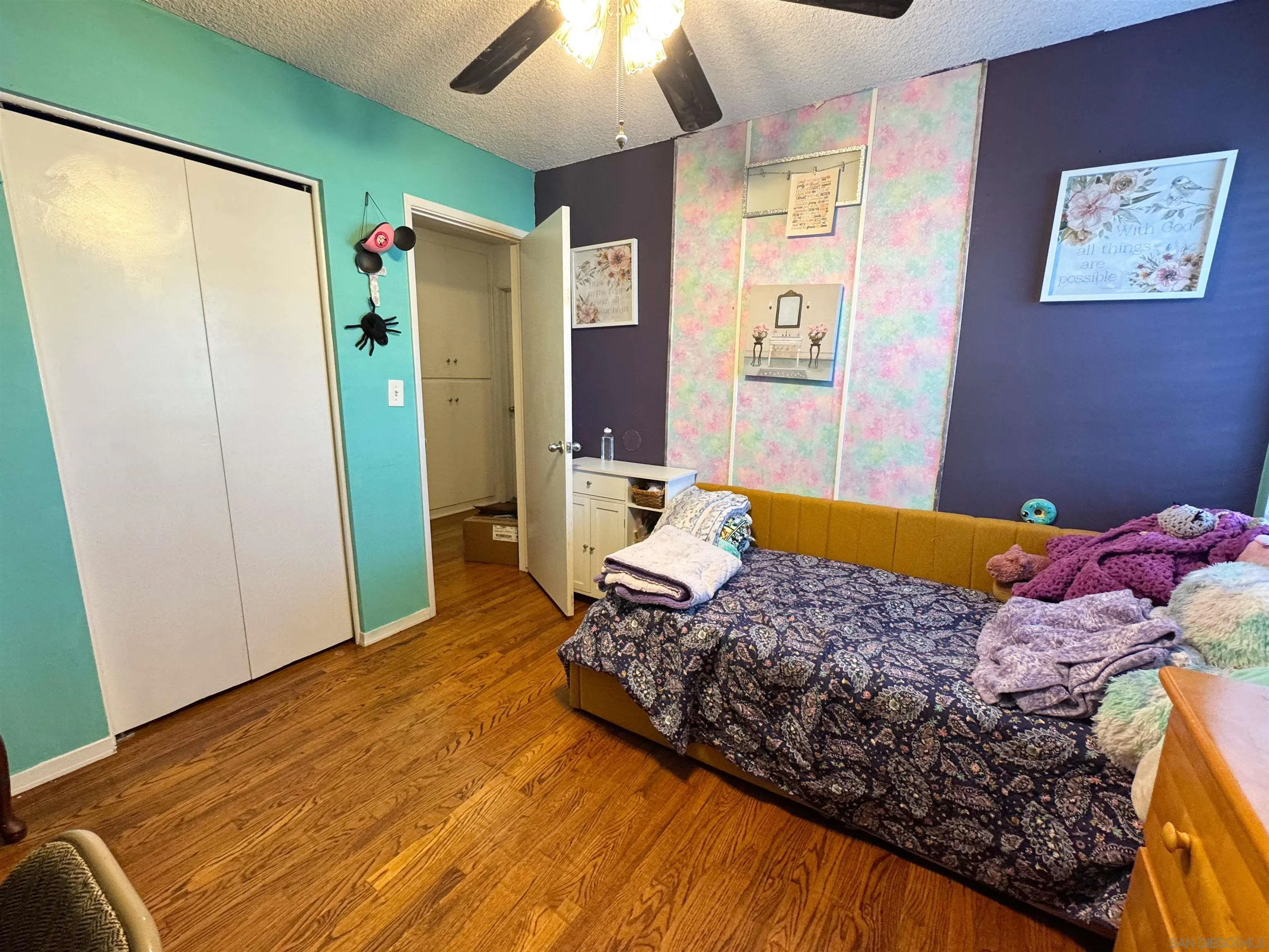 1117 Kings Road Escondido, CA 92027 - Photo 22 of 37 a bedroom with a bed and a refrigerator