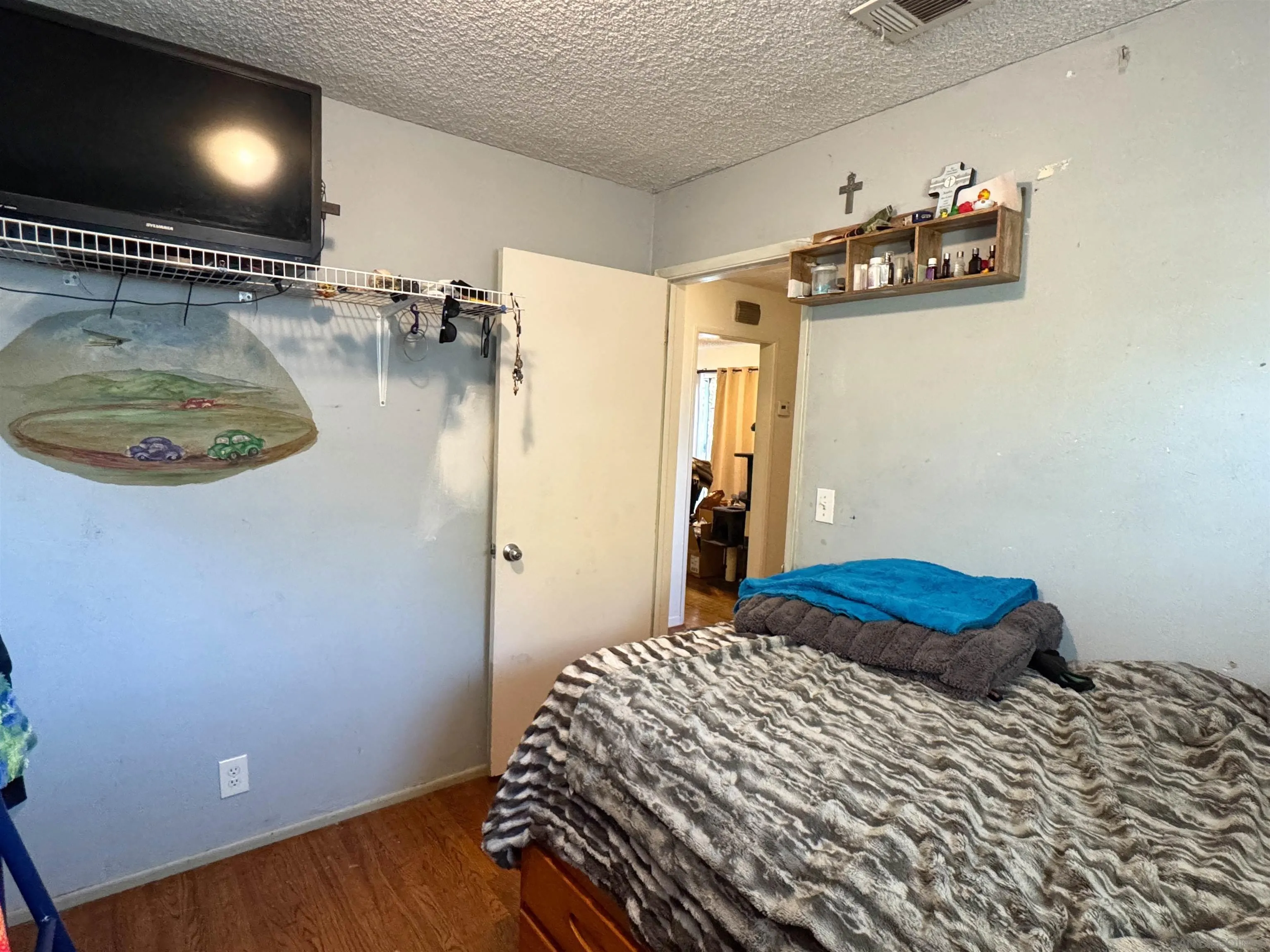 1117 Kings Road Escondido, CA 92027 - Photo 25 of 37 a bedroom with a bed and a mirror