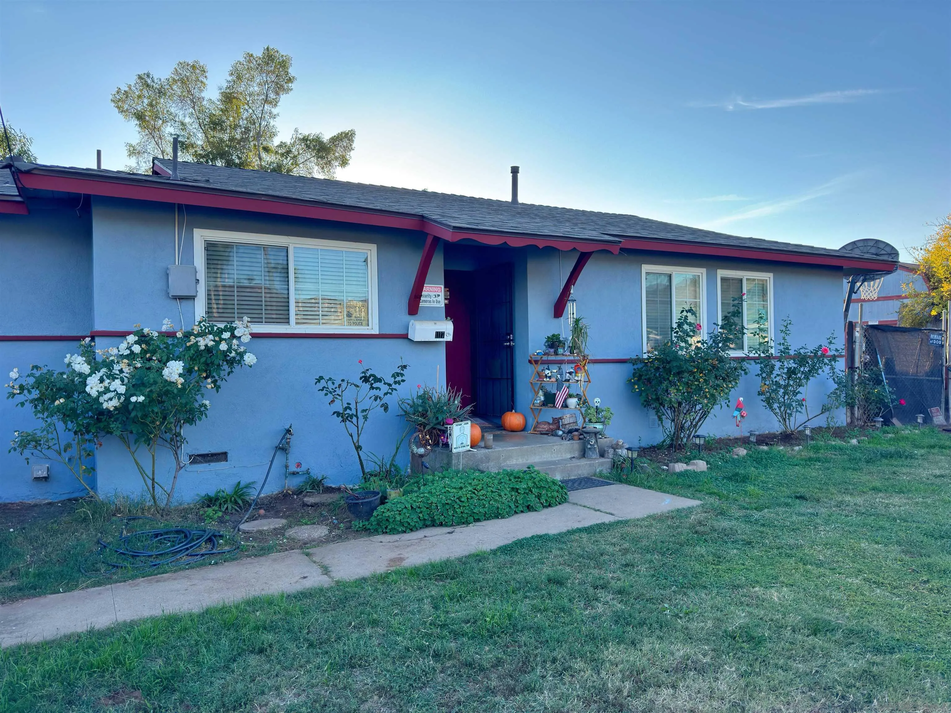 1117 Kings Road Escondido, CA 92027 - Photo 30 of 37 a front view of house with yard and green space