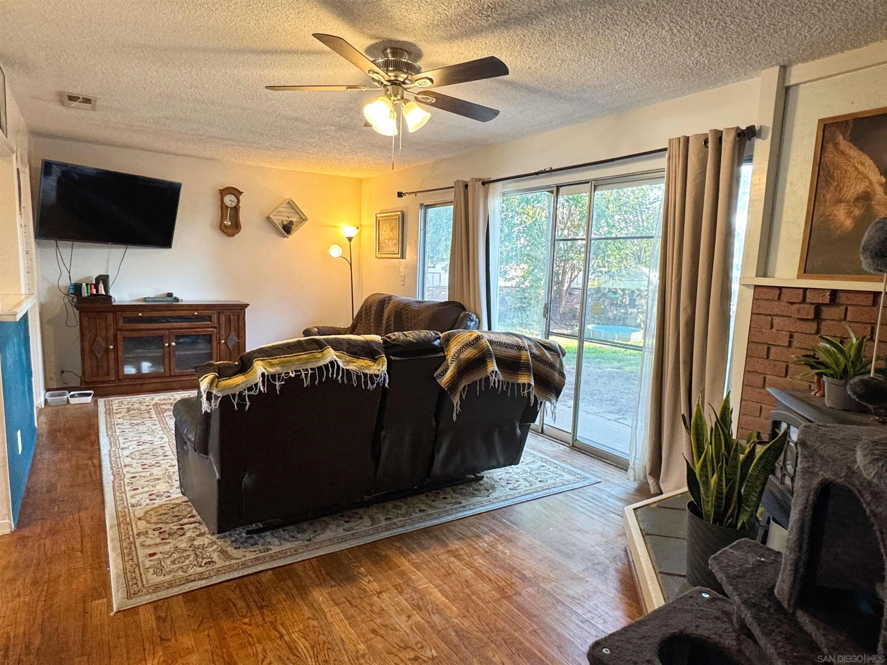 1117 Kings Road Escondido, CA 92027 - Photo 6 of 37 a living room with furniture and a flat screen tv