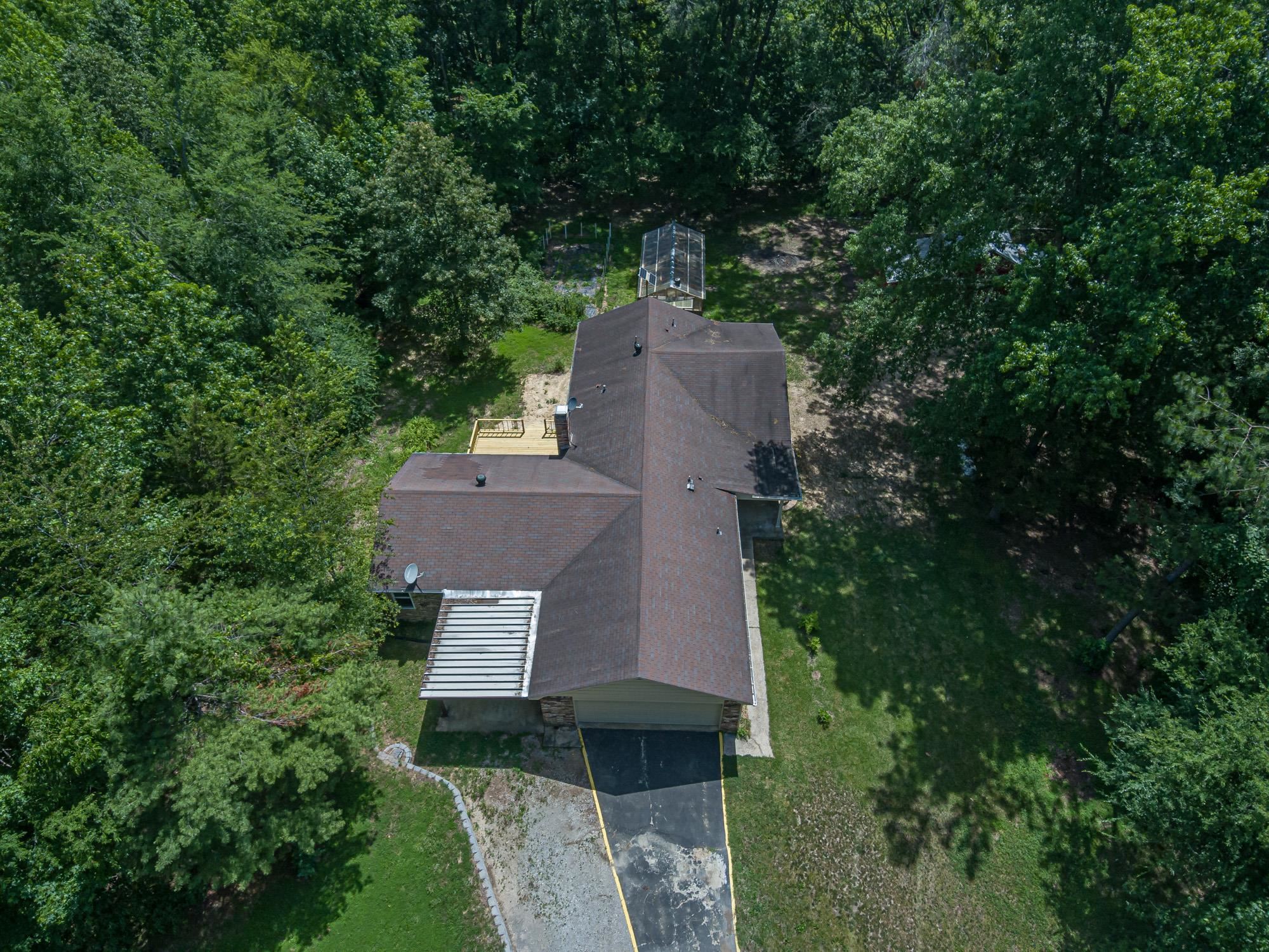 10860 Macedonia Road Brighton, TN 38011 - Photo 2 of 24 an aerial view of a house with a yard and tree s