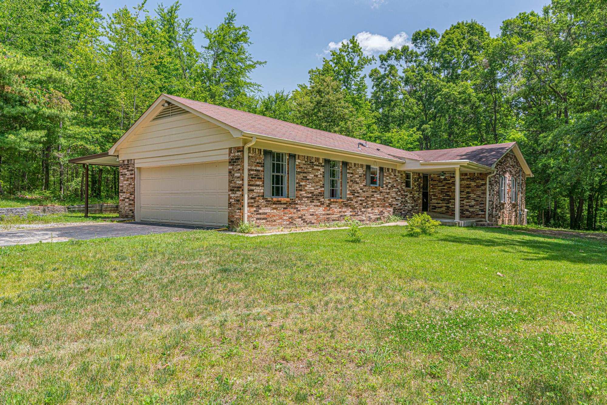 10860 Macedonia Road Brighton, TN 38011 - Photo 3 of 24 a front view of house with yard and green space